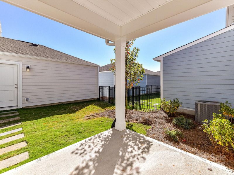 Exterior details and patio area of a home in North Creek Village - Townhomes, Huntersville (Image 20).