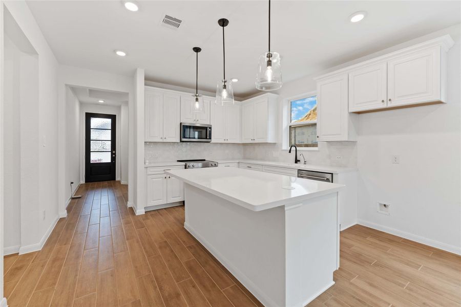 Furnished interior view inside a new home in Sunterra, Katy (Image 11).