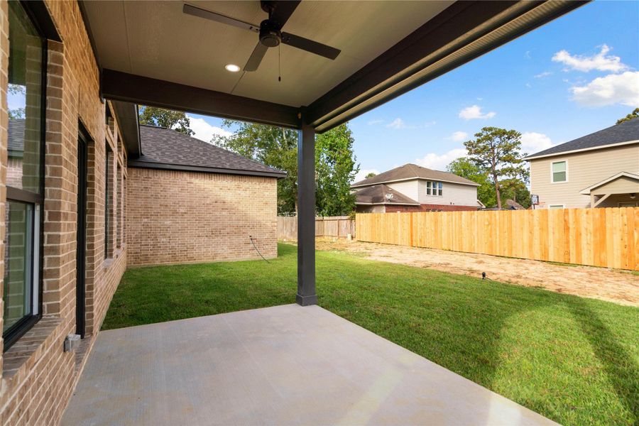 Experience outdoor living year-round with this spacious covered patio, perfect for relaxation and entertaining.