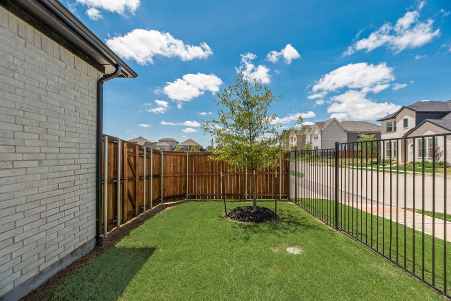 Exterior details and patio area of a home in Cottages of Celina, Celina (Image 3).