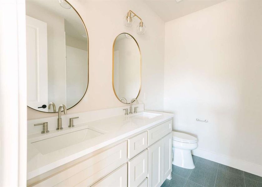 Bathroom with vanity and toilet