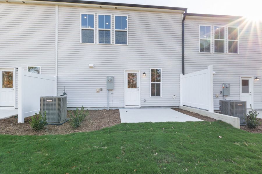 Exterior details and patio area of a home in Poets Walk, Whitsett (Image 3).