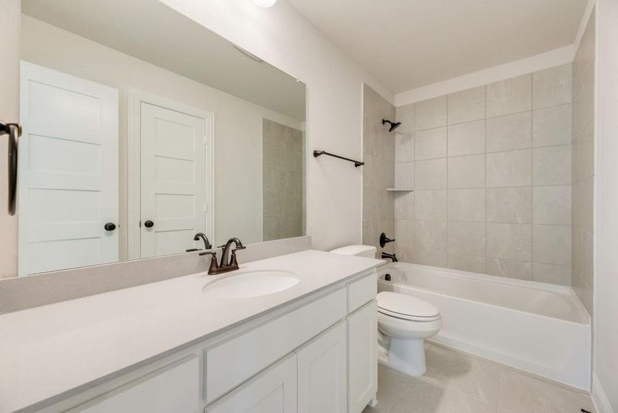 Furnished interior view inside a new home in Dominion of Pleasant Valley, Wylie (Image 13).