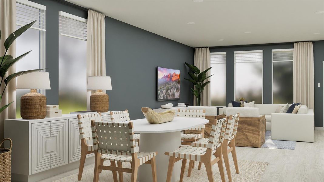 Dining space featuring light wood finished floors Dining space featuring light wood finished floors