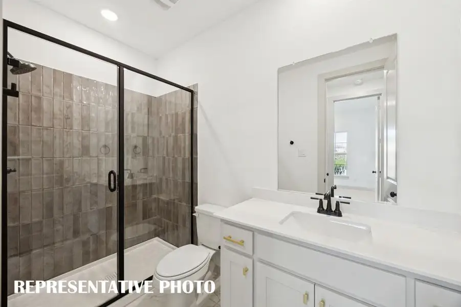 Friends and family will feel right at home in any of the beautfiully finished guest baths offered in our Versailles III plan.  REPRESENTATIVE PHOTO