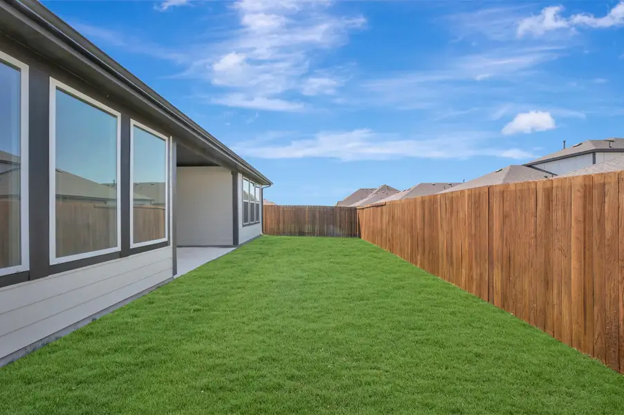 Exterior details and patio area of a home in The Meadows, Denton (Image 17).
