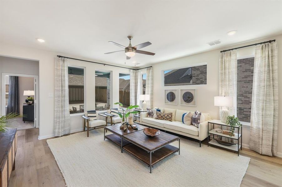 With a wall of windows looking out to your back yard, this family room offers a warm and inviting place to gather. With a wall of windows looking out to your back yard, this family room offers a warm and inviting place to gather.