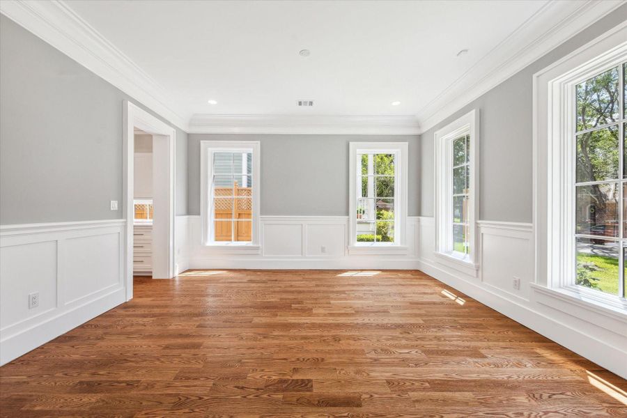 Another view of the dining room--notice the high ceilings beautiful hardwood floors and crown molding and wainscotting!