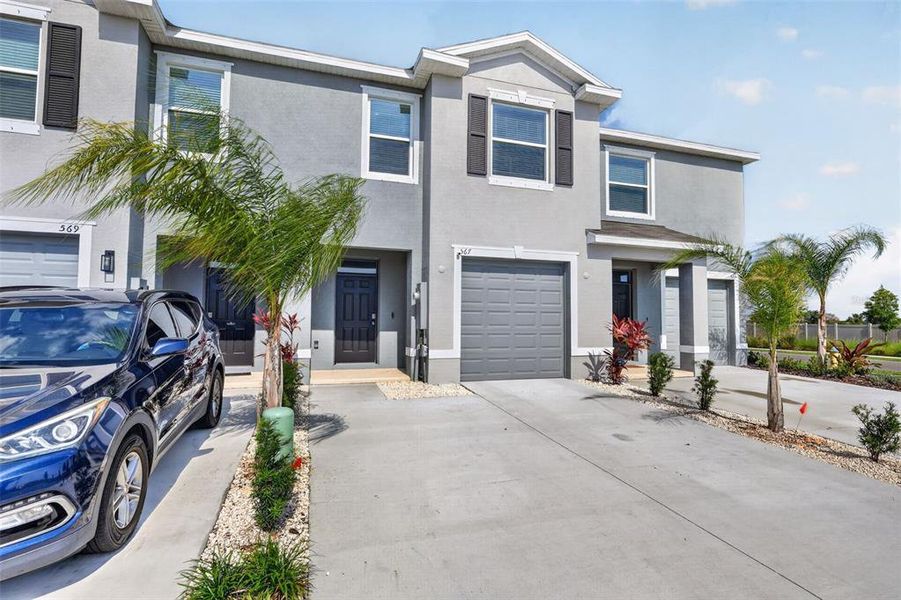 Front exterior of a new home in Mangrove Point, Apollo Beach, FL, highlighting curb appeal (Image 2).