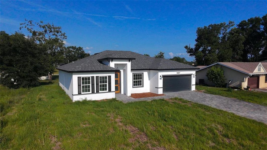 Front exterior of a new home in , Ocala, FL, highlighting curb appeal (Image 2). Front exterior of a new home in , Ocala, FL, highlighting curb appeal (Image 2).
