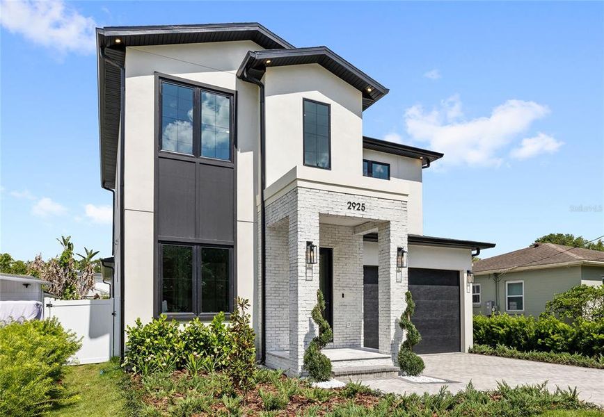 Front exterior of a new home in , Orlando, FL, highlighting curb appeal (Image 35).