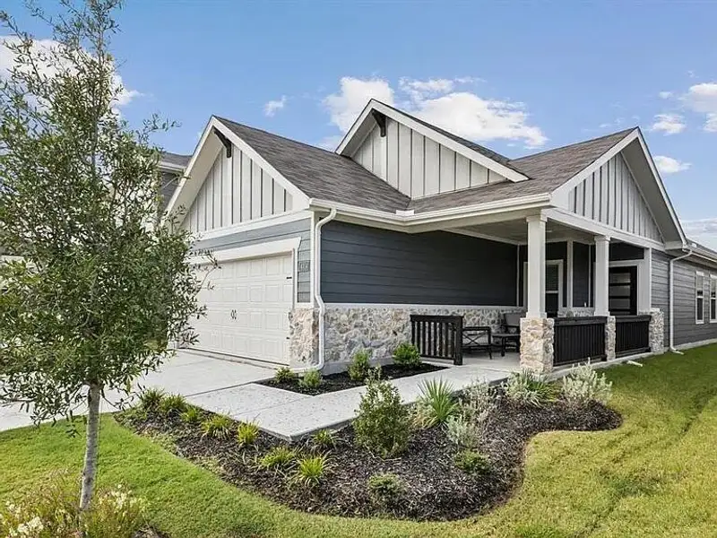 Front exterior of a new home in Lakehaven - Spring Series, Farmersville, TX, highlighting curb appeal (Image 1). Front exterior of a new home in Lakehaven - Spring Series, Farmersville, TX, highlighting curb appeal (Image 1).