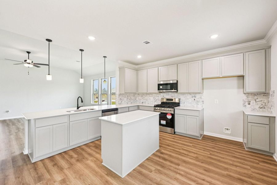 Chef-inspired kitchen featuring a LARGE ISLAND, modern finishes, and plenty of cabinet space!
