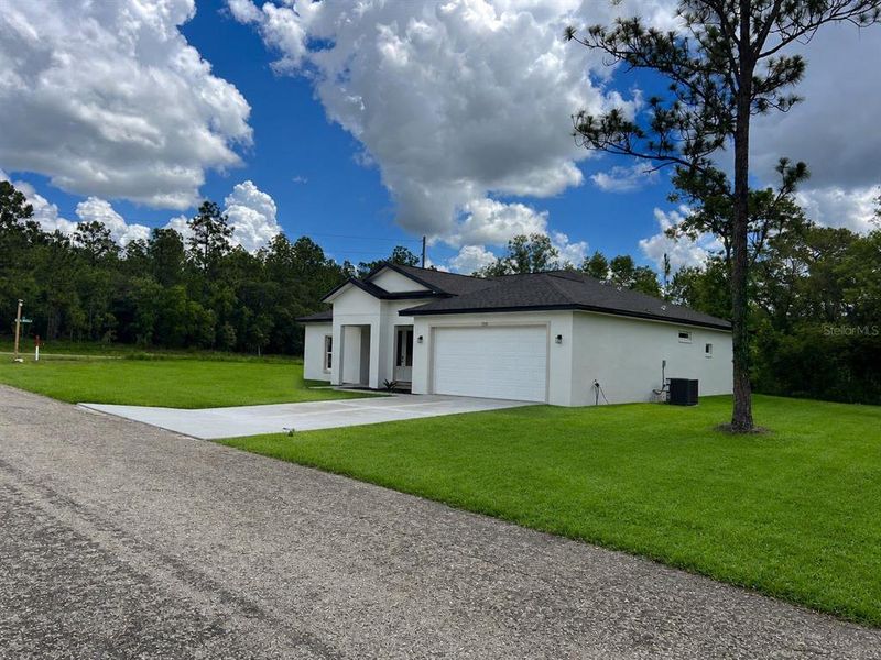 Front exterior of a new home in , Citrus Springs, FL, highlighting curb appeal (Image 1). Front exterior of a new home in , Citrus Springs, FL, highlighting curb appeal (Image 1).