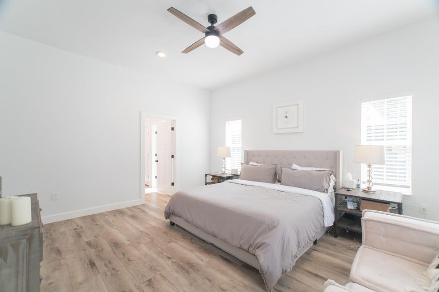 The primary suite is a tranquil escape, with this view leading into the beautifully designed bathroom. The primary suite is a tranquil escape, with this view leading into the beautifully designed bathroom.