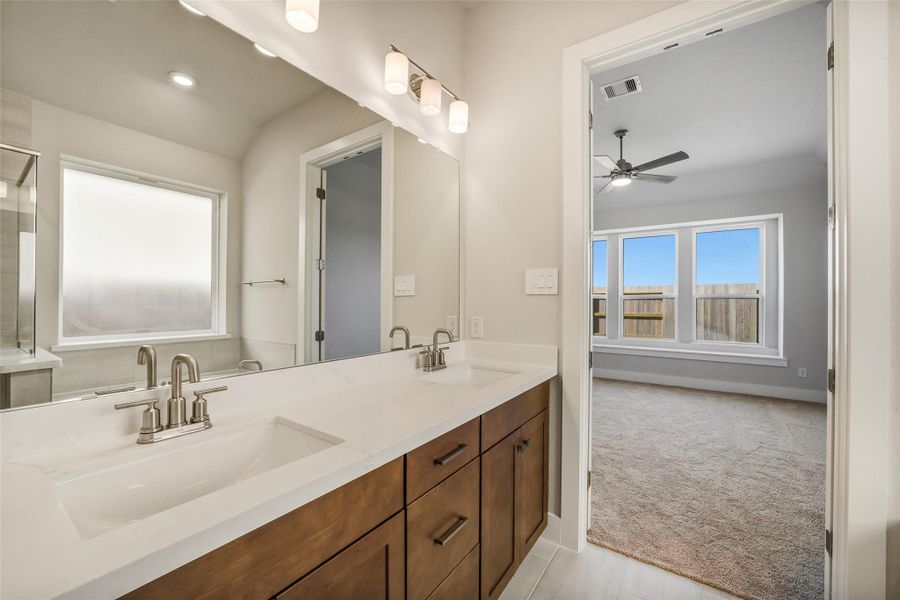 Furnished interior view inside a new home in Sunterra, Katy (Image 12).