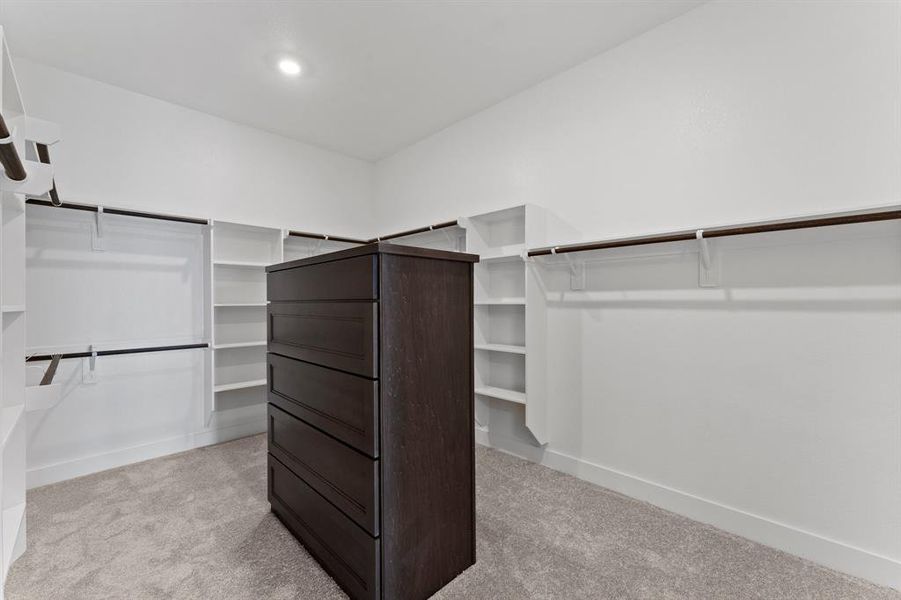 Walk-in Closet with Custom Drawers at Primary Bedroom