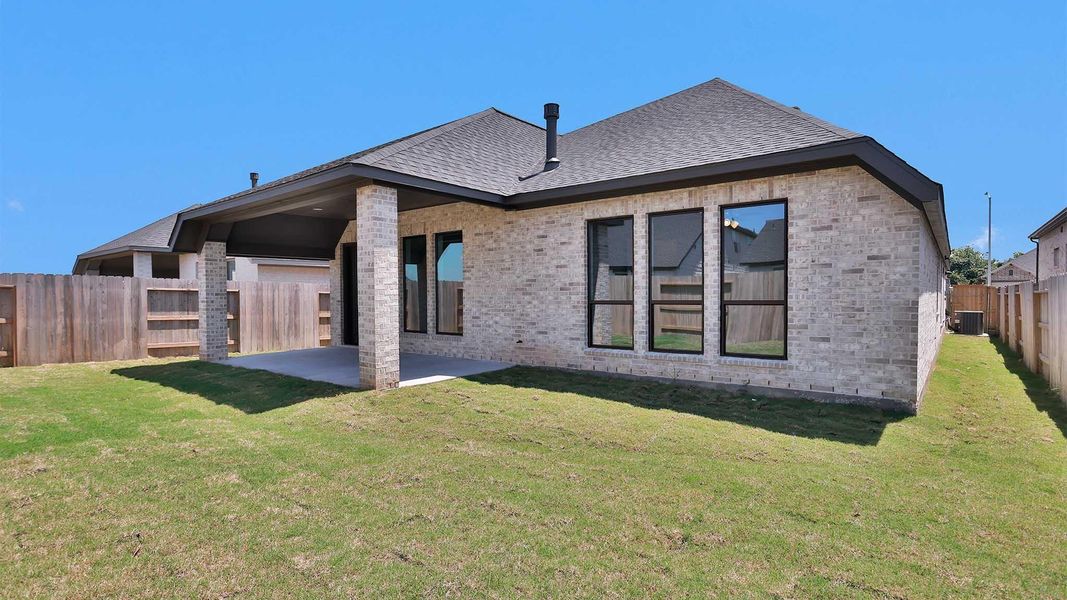 Exterior details and patio area of a home in Grange, Katy (Image 2). Exterior details and patio area of a home in Grange, Katy (Image 2).