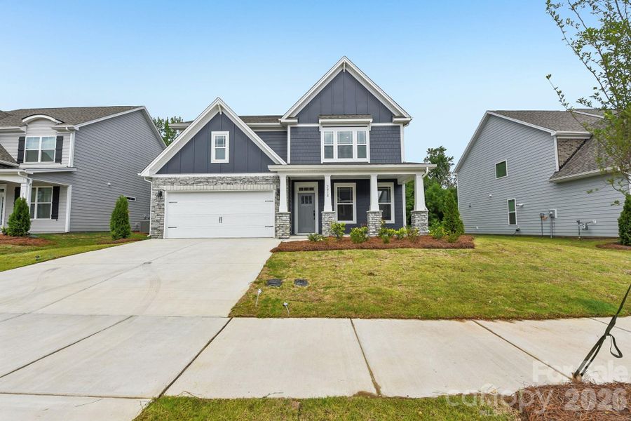 Front exterior of a new home in Sanctuary at Southgate, Indian Trail, NC, highlighting curb appeal (Image 2). Front exterior of a new home in Sanctuary at Southgate, Indian Trail, NC, highlighting curb appeal (Image 2).