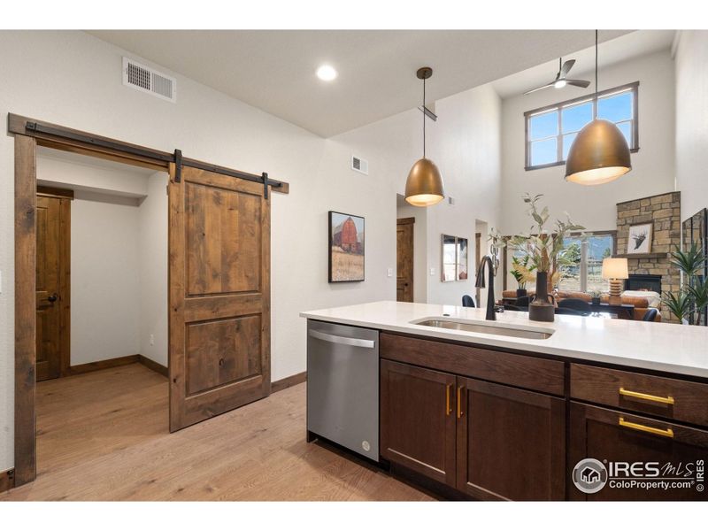 Sliding barn door to mud room and laundry room