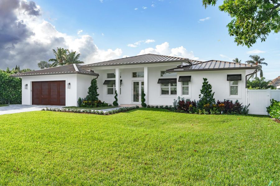 Front exterior of a new home in , Boynton Beach, FL, highlighting curb appeal (Image 2). Front exterior of a new home in , Boynton Beach, FL, highlighting curb appeal (Image 2).