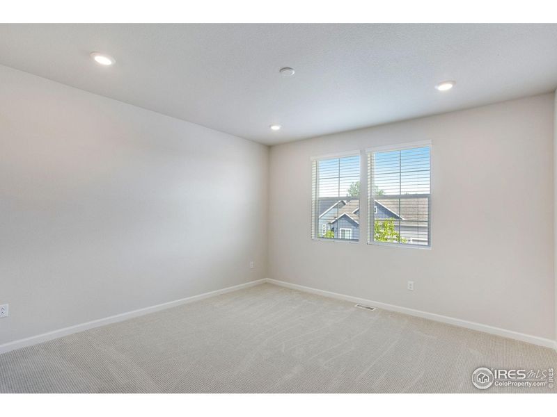 Spacious, unfurnished interior of a new home in Westside Crossing, Berthoud (Image 35).