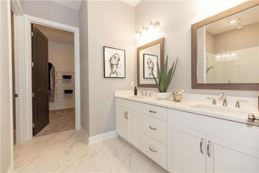 The adjoining spa-like bathroom is a sanctuary of relaxation and rejuvenation, designed with high-end finishes and thoughtful details.