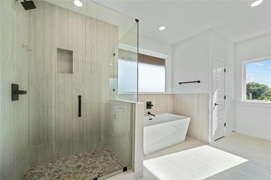 Bathroom featuring a shower stall, a freestanding bath, a wainscoted wall, and recessed lighting Bathroom featuring a shower stall, a freestanding bath, a wainscoted wall, and recessed lighting