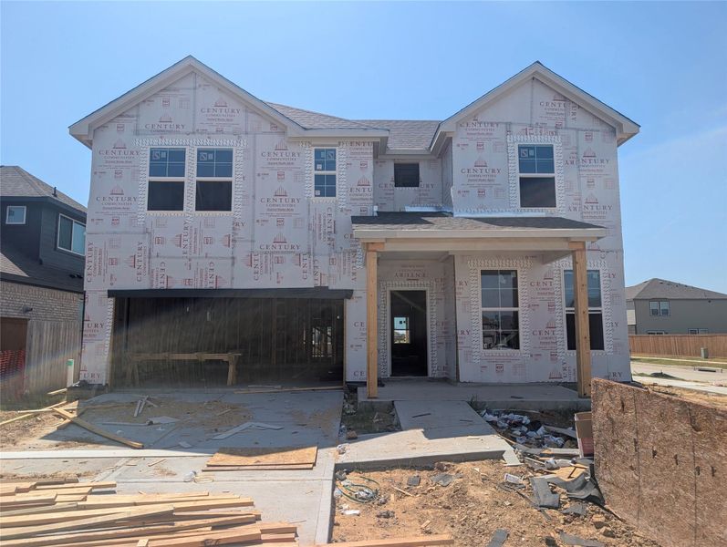 In-progress construction of a new home in Sunterra, Katy, TX (Image 26).