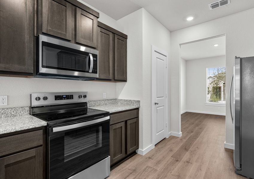 The kitchen has sprawling granite countertops.