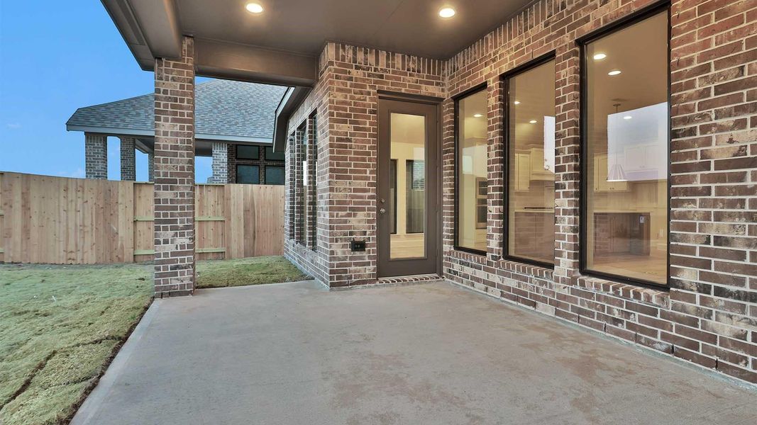 Exterior details and patio area of a home in Meridiana, Manvel (Image 3).