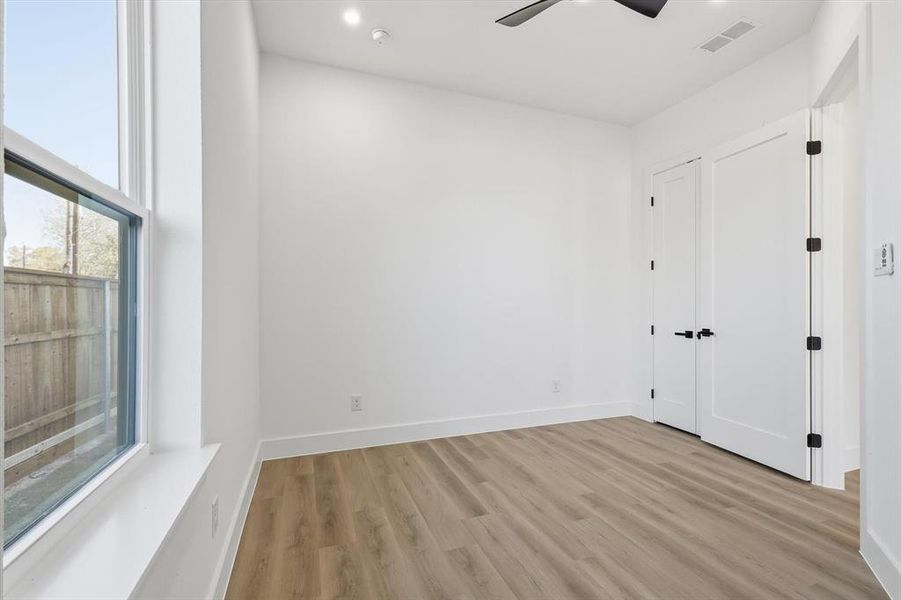 Unfurnished bedroom with light wood-style floors, recessed lighting, and ceiling fan Unfurnished bedroom with light wood-style floors, recessed lighting, and ceiling fan