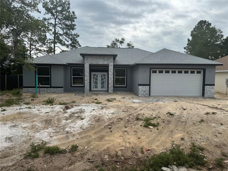 Front exterior of a new home in , Ocala, FL, highlighting curb appeal (Image 8).