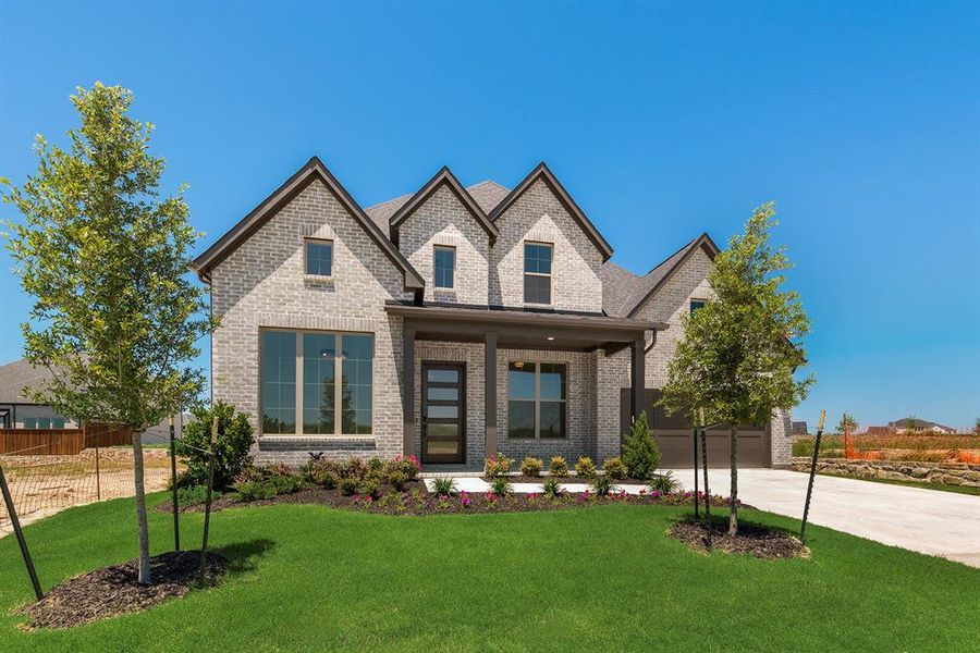 Front exterior of a new home in The Homestead - 62', Rockwall, TX, highlighting curb appeal (Image 24).