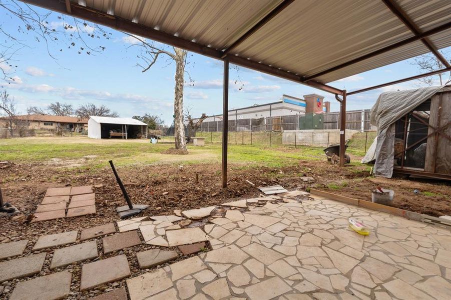 View of patio with an outbuilding