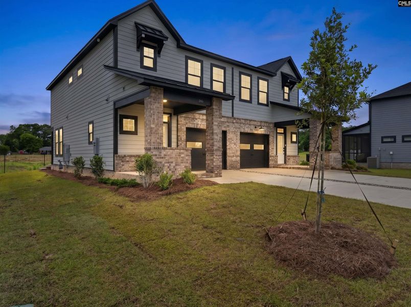 Front exterior of a new home in Dunbar Village, Cayce, SC, highlighting curb appeal (Image 25). Front exterior of a new home in Dunbar Village, Cayce, SC, highlighting curb appeal (Image 25).