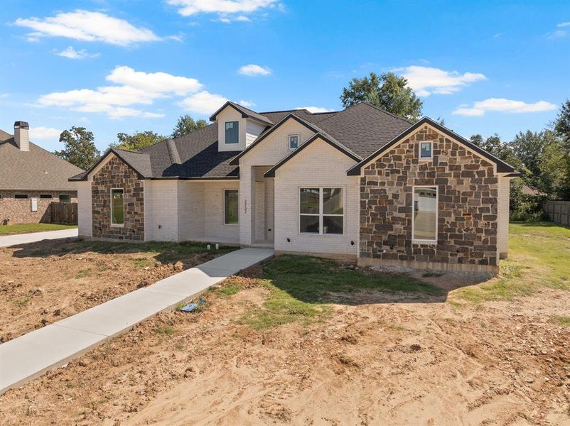 Front exterior of a new home in , Mount Pleasant, TX, highlighting curb appeal (Image 23). Front exterior of a new home in , Mount Pleasant, TX, highlighting curb appeal (Image 23).