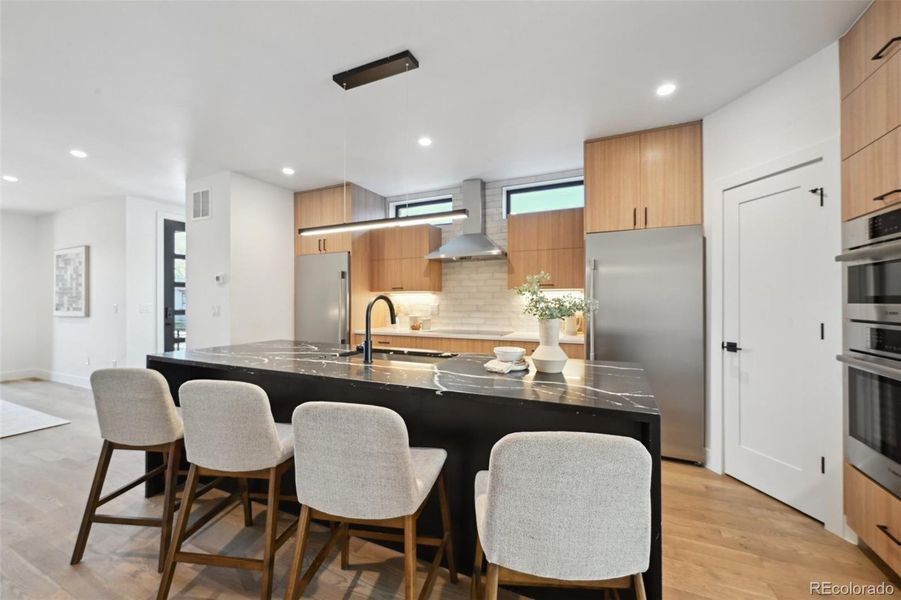 Enjoy meals or emails at the eat-in, over sized kitchen island