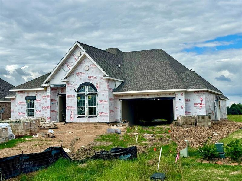 One-story home with 4 bedrooms, 3 baths and 3 car tandem garage