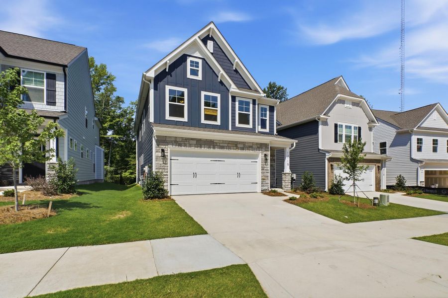 Front exterior of a new home in Caldwell Forest, Charlotte, NC, highlighting curb appeal (Image 23). Front exterior of a new home in Caldwell Forest, Charlotte, NC, highlighting curb appeal (Image 23).