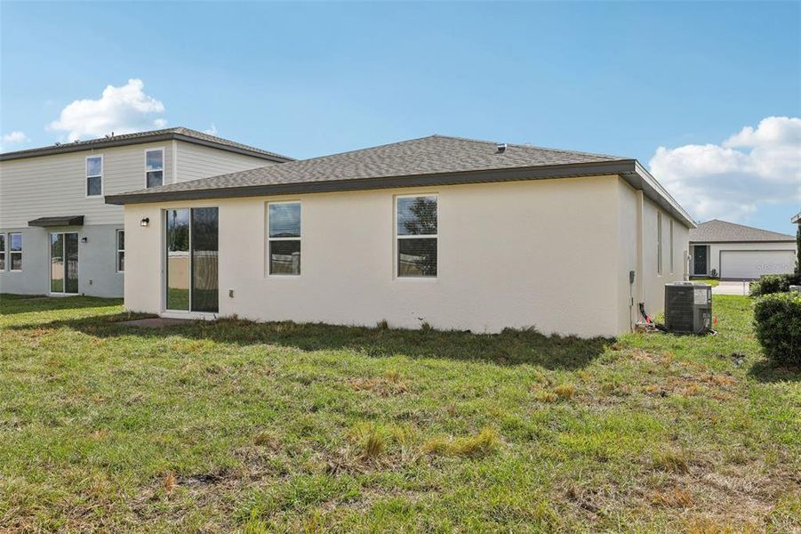 Exterior details and patio area of a home in Lawson Dunes - Signature Series, Haines City (Image 24).