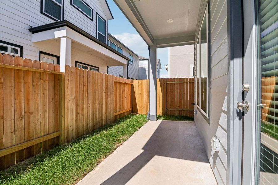 Exterior details and patio area of a home in Spring Brook Village - Luxe Series, Houston (Image 3). Exterior details and patio area of a home in Spring Brook Village - Luxe Series, Houston (Image 3).