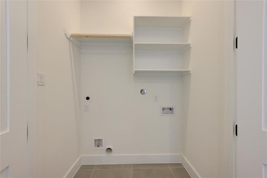 Utility room on 3rd floor with both an electric and natural gas hookup for the dryer.