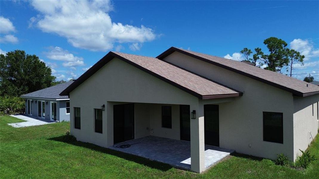 Front exterior of a new home in , Rotonda West, FL, highlighting curb appeal (Image 2).