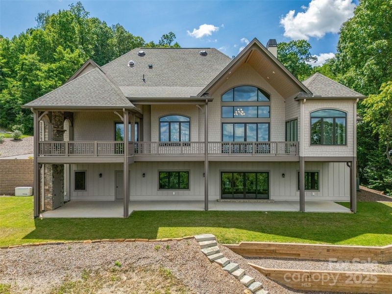 Front exterior of a new home in , Zirconia, NC, highlighting curb appeal (Image 23). Front exterior of a new home in , Zirconia, NC, highlighting curb appeal (Image 23).