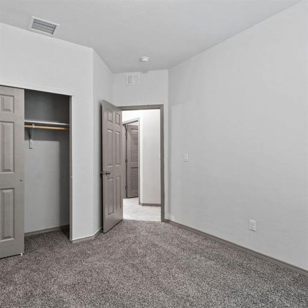 This spacious bedroom is the perfect place to relax and unwind after a long day.  **This image is from another Saratoga Home with similar floor plan - Myrtle Floorplan.**