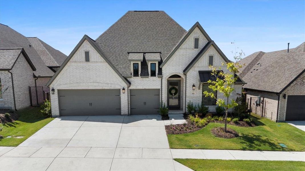 Front exterior of a new home in , Lavon, TX, highlighting curb appeal (Image 21). Front exterior of a new home in , Lavon, TX, highlighting curb appeal (Image 21).