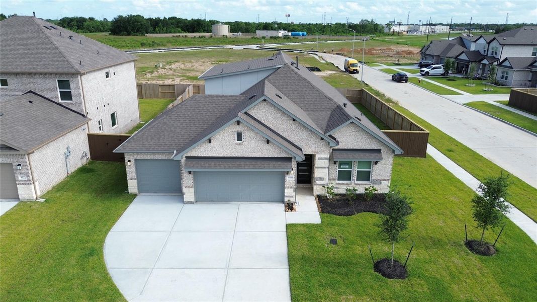 Front exterior of a new home in Foxtail Palms, Manvel, TX, highlighting curb appeal (Image 18).