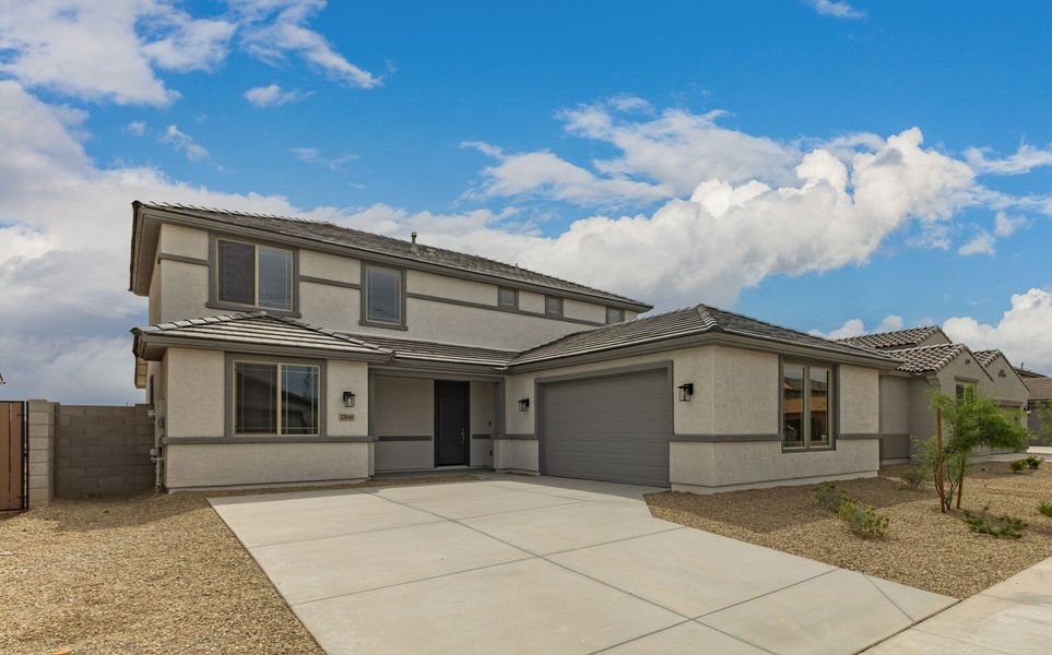 Front exterior of a new home in Bentridge, Buckeye, AZ, highlighting curb appeal (Image 1). Front exterior of a new home in Bentridge, Buckeye, AZ, highlighting curb appeal (Image 1).