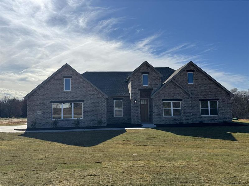 Front exterior of a new home in Taylor Ranch, Springtown, TX, highlighting curb appeal (Image 2).